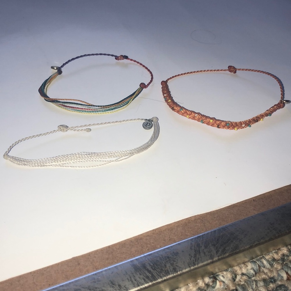 white, multi-colored, and orange bracelet
